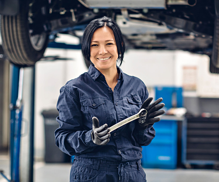Woman holding wrench